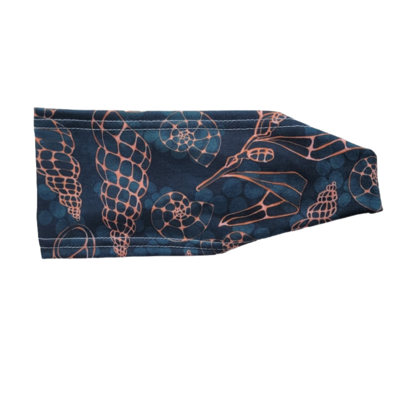 headband with gold outline shells on dark green