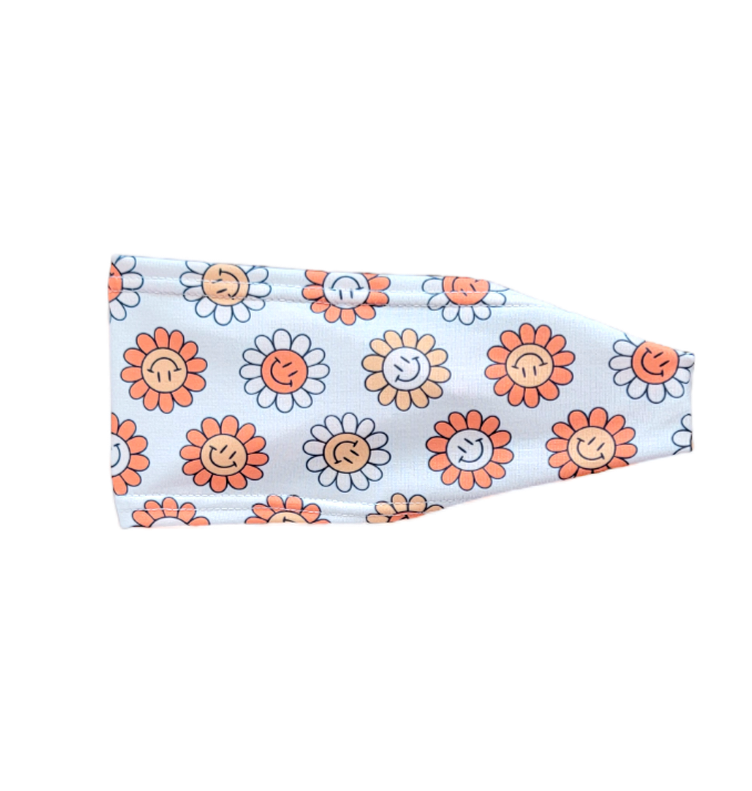 Headband with orange and white flowers with simley faces