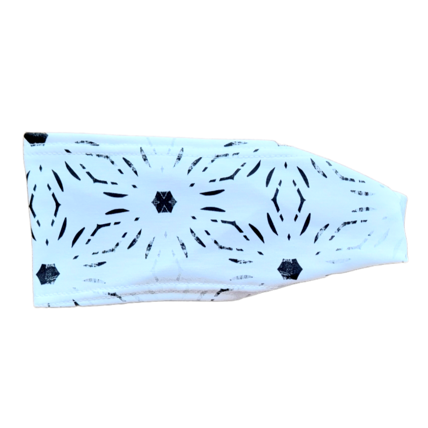 headband with black geometric design on white