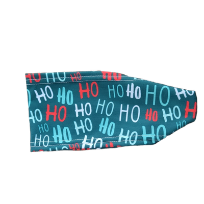 headband with red white and green on dark green says ho ho ho