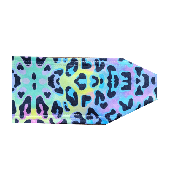 headband with black leopard sopts on neon colored background