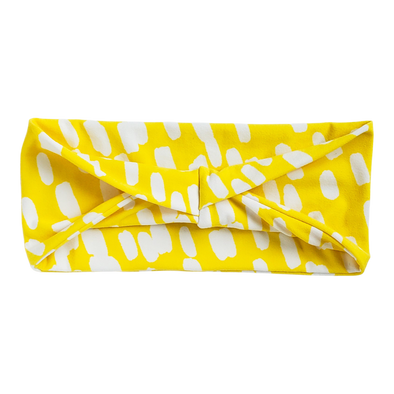 yellow headband with white spots